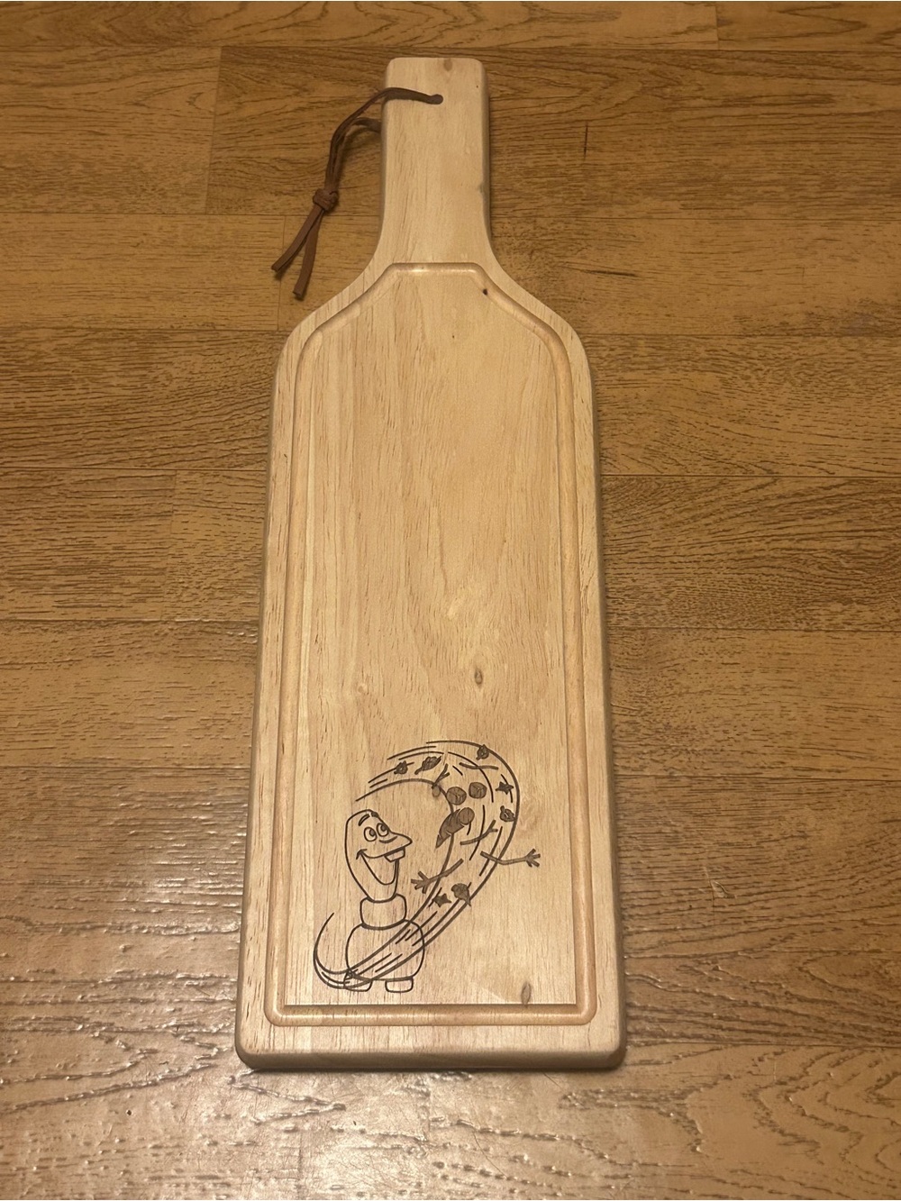 Disney wooden board featuring Olaf.
